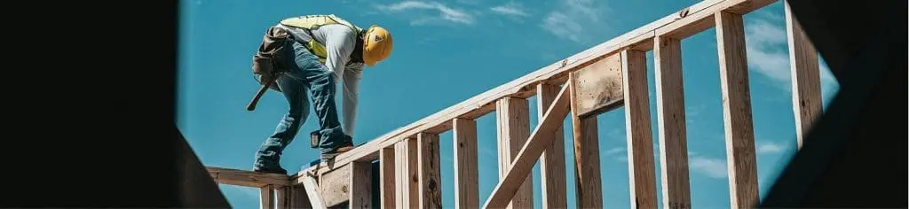 General contractor working on a building frame