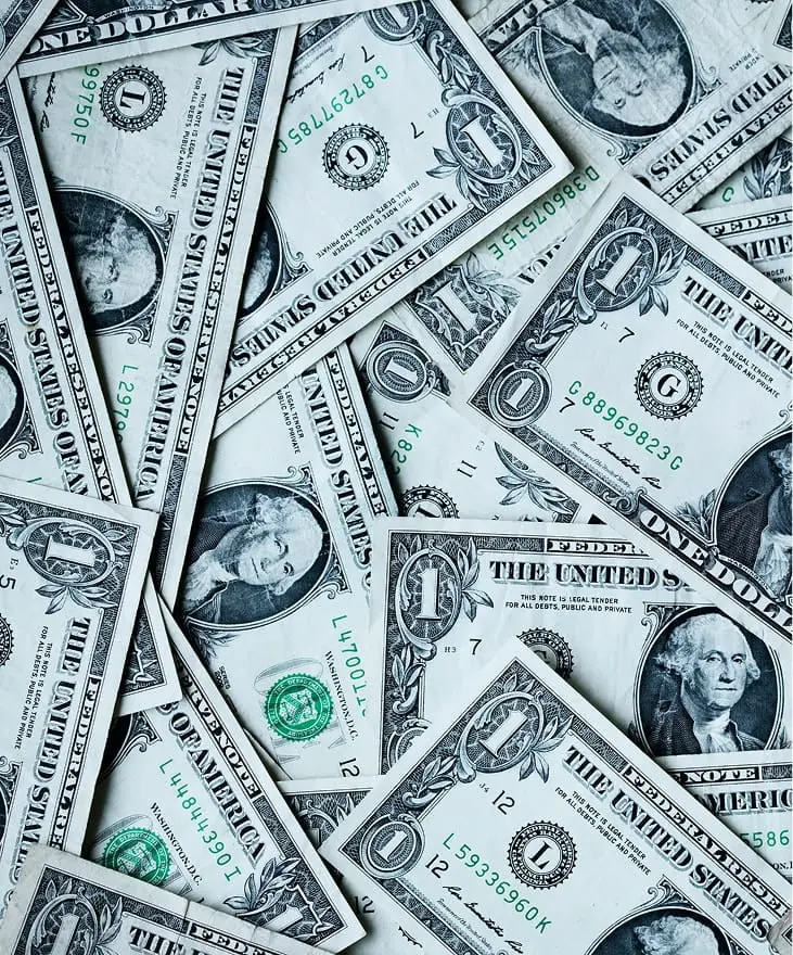 US dollar bills representing roofing insurance costs