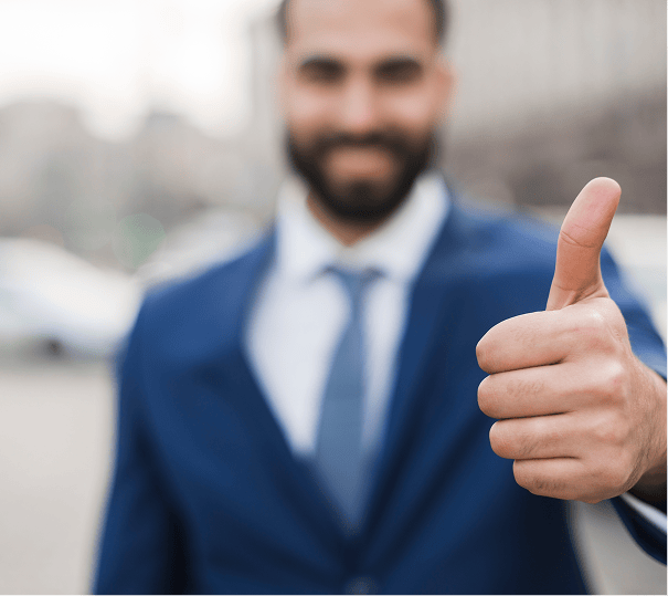 Business professional giving a thumbs up