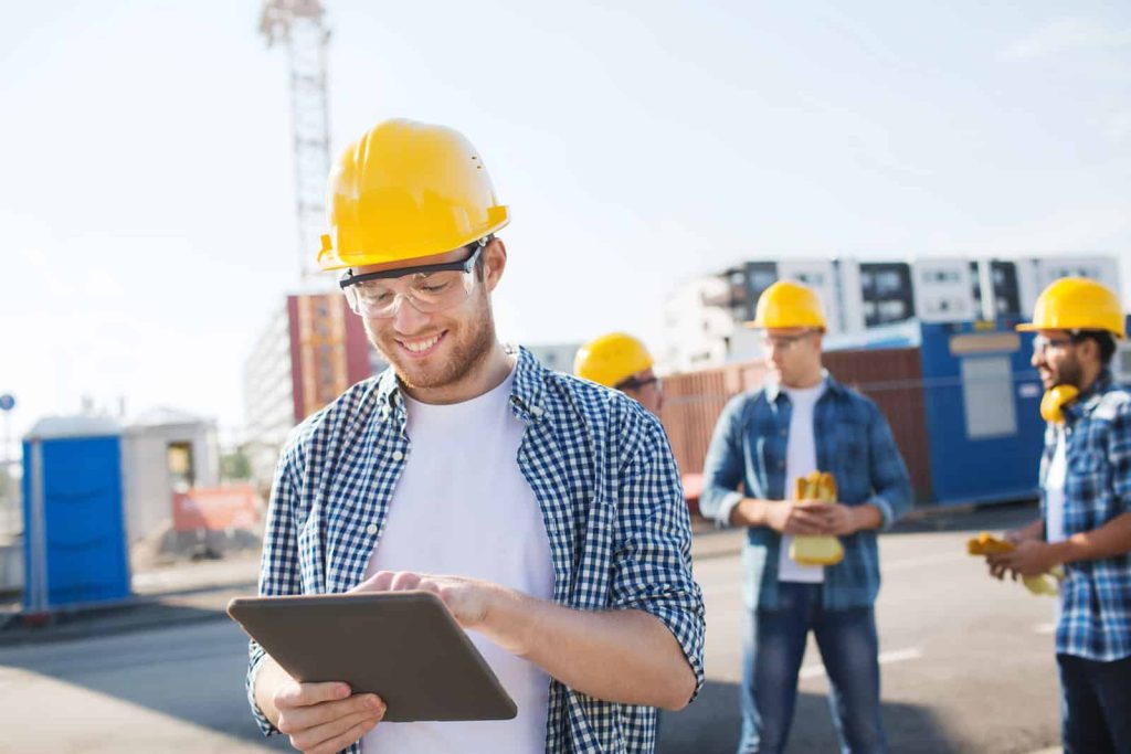 Happy workers at construction site