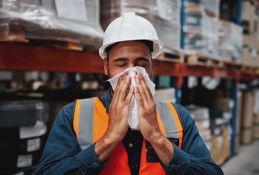 Worker wiping off sweat