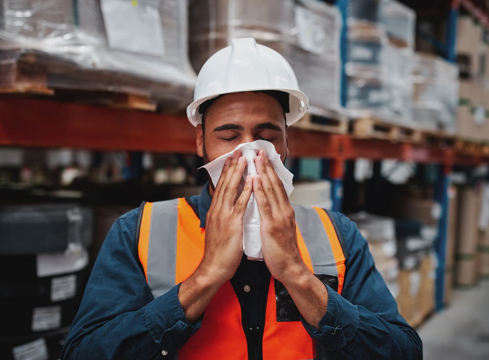 Worker wiping off sweat