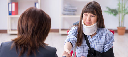 injured woman greeting another woman